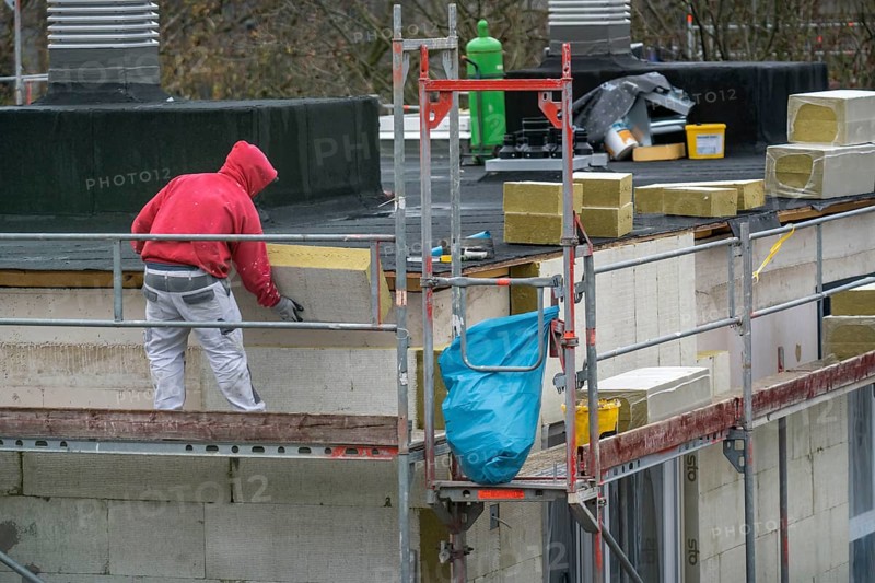 Building site, thermal insulation, external insulation, facade insulation, is attached to the facade of a new building, glued, Duisburg, North Rhine-Westphalia, Germany, Europe