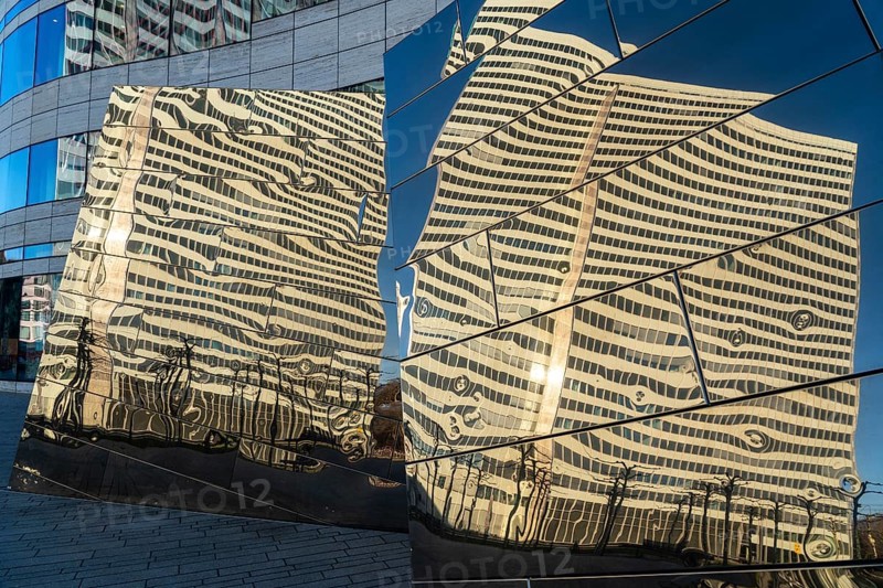 Reflection of the Dreischeibenhaus in the façade of the Kö-Bogen building, shops, restaurants and offices, am Hofgarten, Düsseldorf, Germany, Europe