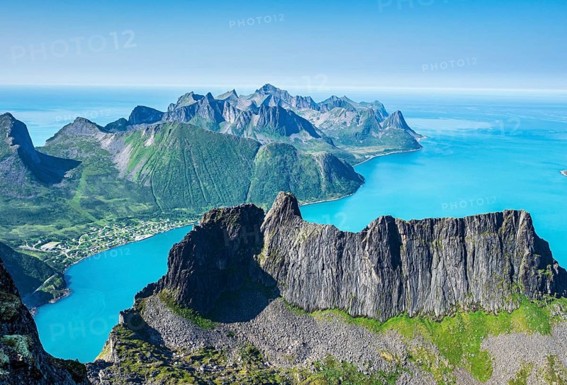 View over fjord Örnfjord, village Fjordgard, peak of Segla (left) and Hesten, seen from mountain Grytetippen, island Senja, Troms, Norway, Europe