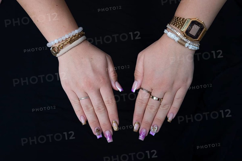 Colourful fingernails of a young woman, on a black background, Baden-Württemberg, Germany, Europe