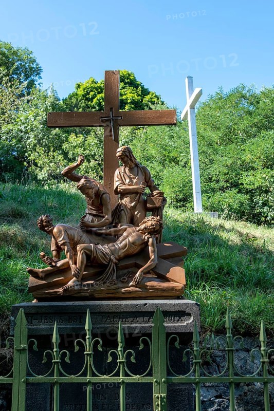 Orcival in Auvergne Volcanoes Regional Natural Park, Statues of Christ's Way of the Cross. Puy de Dome. Auvergne-Rhone-Alpes. France