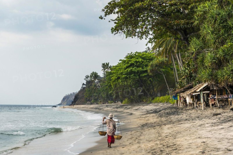 Trader at Mangsit beach in Sengiggi, seller, man, palm beach, travel, tourism, sea, beach, water, palm tree, ocean, island, coast, tropical, tropics, asian, natural landscape, untouched, wooden hut, beach hut, tourism, holiday, lonely, deserted, calm, authentic, authenticity, original, atmosphere, holiday mood, long-distance travel, tradition, traditional, poverty, culture, tradition, holiday idyll, Lombok, Indonesia, Asia