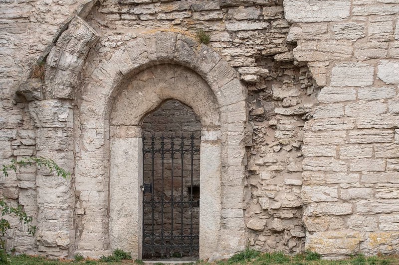 Wrought-iron door, wall, church ruins, Hanseatic city of Visby, UNESCO World Heritage Site, Gotland Island, Sweden, Europe