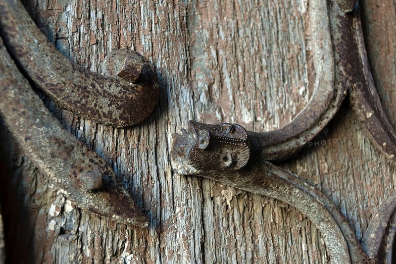 Orcival. Intricate Roman wrought iron hinge displayed at the Basilica Notre-Dame d'Orcival, Puy de dome, Auvergne-Rhone-Alpes, France, Europe
