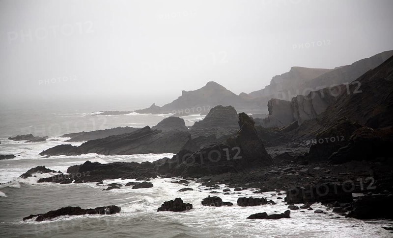 Large Atlantic storm waves crashing onto jagged rocky coast at Hartland Quay, north Devon, England, United Kingdom, Europe