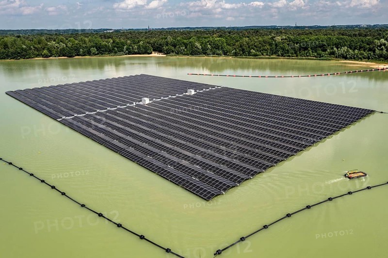 Germany's largest floating solar power plant on the Silbersee III, a quarry pond no longer used for sand mining, near Haltern am See, operated by Quarzwerke GmbH, around 5800 solar modules, on an area of a good 2 football pitches, generate 3.1 megawatts of power, the company uses the electricity itself on weekdays, at weekends it flows into the public grid, North Rhine-Westphalia, Germany, Europe