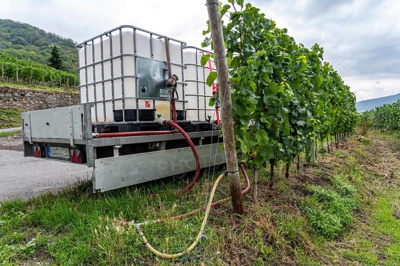 Upper Middle Rhine Valley, water tank for irrigating grapevine plants, in the Kapellenberg vineyard near Lorch, Hesse, Germany, Europe