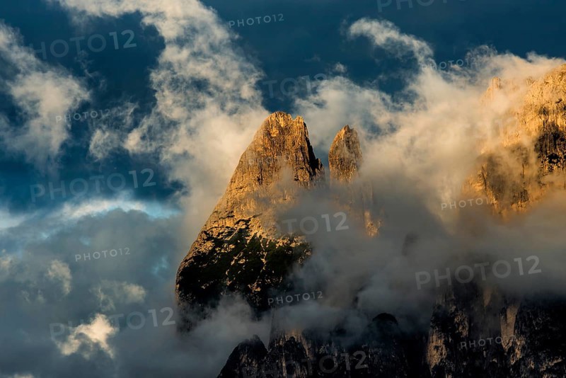 Sunset and mountain peaks in the clouds, Catinaccio, Dolomites, South Tyrol, Trentino-Alto Adige, Italy, Europe