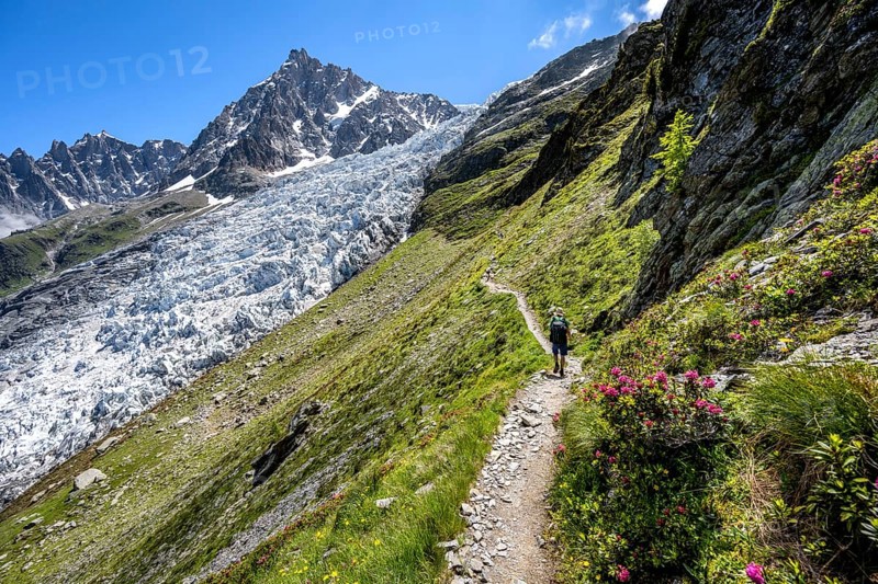 Hiking on the trail to La Jonction, Glacier des Bossons, behind the summit of the Aiguille du Midi, Chamonix, Haute-Savoie, France, Europe