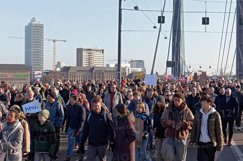 Demonstrators march across the Rheinknie Bridge, large demonstration against right-wing extremism and AfD on 27 January 2024 in Düsseldorf, North Rhine-Westphalia, Germany, Europe