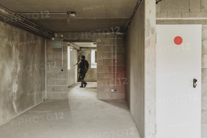 A soldier moves during a simulated house-to-house battle, taken as part of a Bundeswehr exercise with armed forces from Norway and the Czech Republic during the 'Wettiner Schwert' exercise as part of Quadriga 2024 in the training town of Schnöggersburg, 8 April 2024