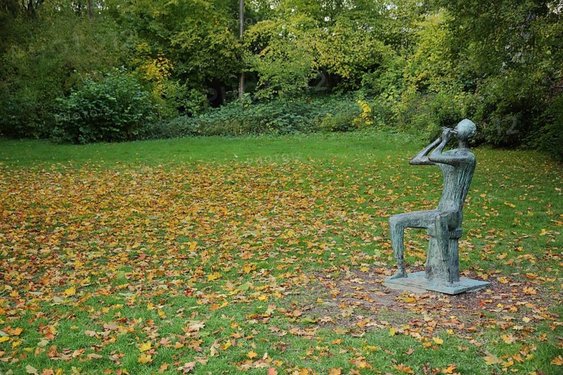Flute player by Walter Wadephul 1965 in autumn, park, lawn, fallen leaves, leaf fall, autumn, spa gardens, city centre, Wiesbaden, Taunus, Hesse, Germany, Europe