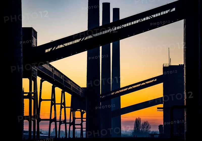 Zollverein Coal Mine Industrial Complex World Heritage Site, Zollverein coking plant, chimneys and conveyor bridges in the evening light, Essen, Germany, Europe