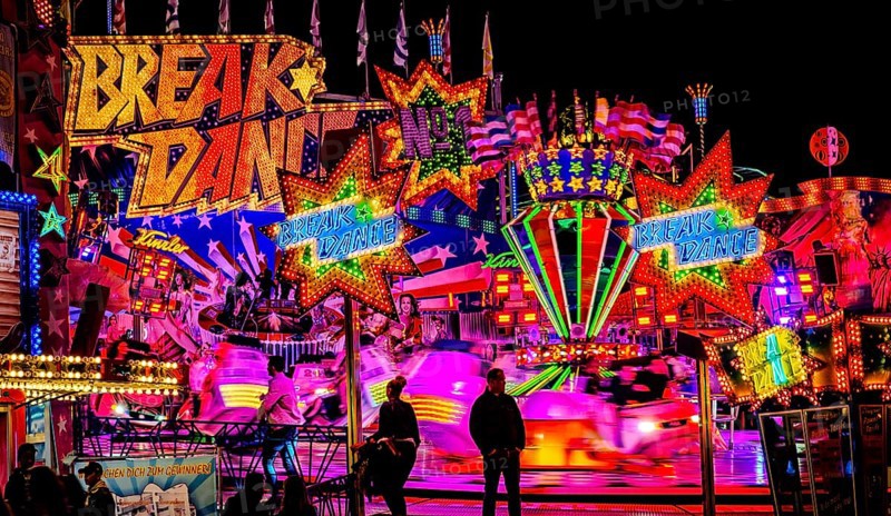 Breakdance fair ride at night with colourful lights, Cannstatter Wasen, Bad Cannstatt, Stuttgart, Baden-Württemberg, Germany, Europe