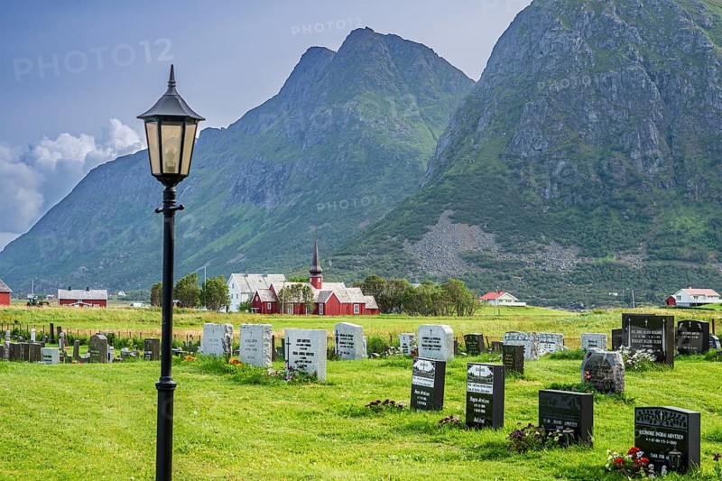 Graveyard of Flakstad, Flakstad church in the back, red wooden building, Flakstad, Lofoten, Norway, Europe