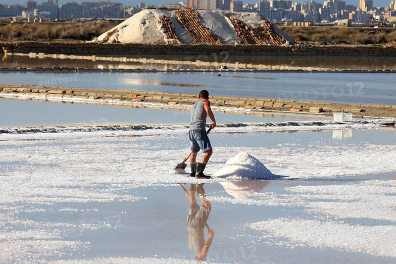 Workers in the salt pans of Trapani, Sicily, Italy, Europe