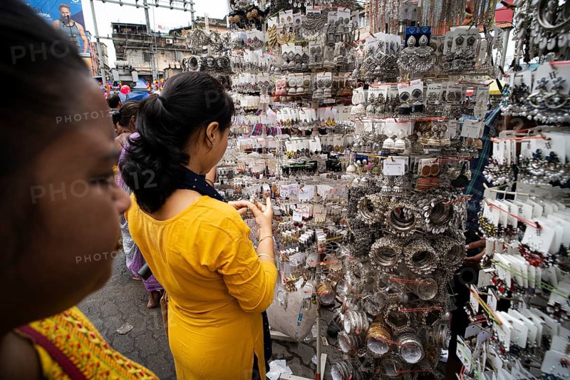 Women buys jewelleries at street market ahead of Durga Puja festival on October 7, 2024 in Guwahati, India. Shopping ahead of Durga Puja is a major event, as people prepare for the celebration
