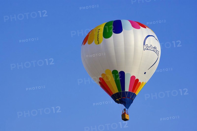 A hot air balloon from the Czech balloon manufacturer Kubicek rises into the air with passengers on board, as part of the aviation festival on the Rossfeld in Metzingen-Glems, Metzingen, Baden-Württemberg, Germany, 11 September 2010, for editorial use only, Europe