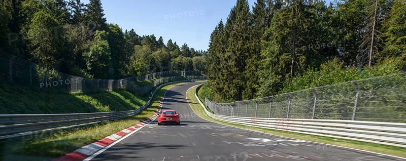 View from the perspective of racing driver Panorama Panoramic photo of track section Pflanzgarten II part 2 with steep gradient depression on international official race track for motorsport Nürburgring race track Nordschleife Green Hell Green Hell former historic country roads in low mountain range Eifel, Nürburg, Rhineland-Palatinate, Germany, Europe