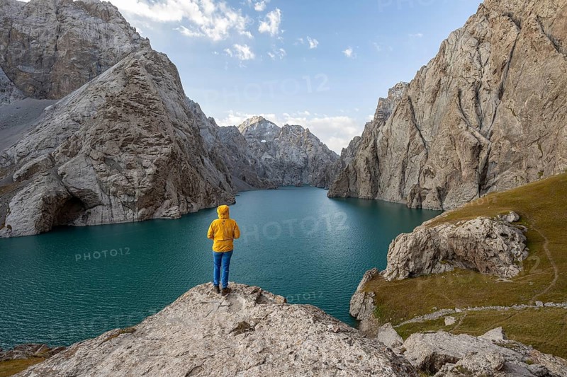Hiker in front of Kol Suu Mountain Lake, Kol Suu Lake, Sary Beles Mountains, Naryn Province, Kyrgyzstan, Asia