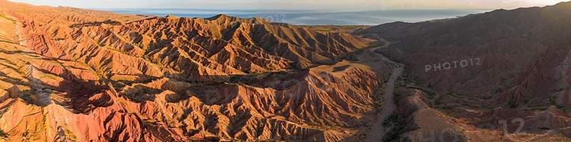 Aerial view, eroded mountain landscape, sandstone cliffs, canyon with red and orange rock formations, Farytale Canyon Skazka, Issyk Kul, Kyrgyzstan, Asia