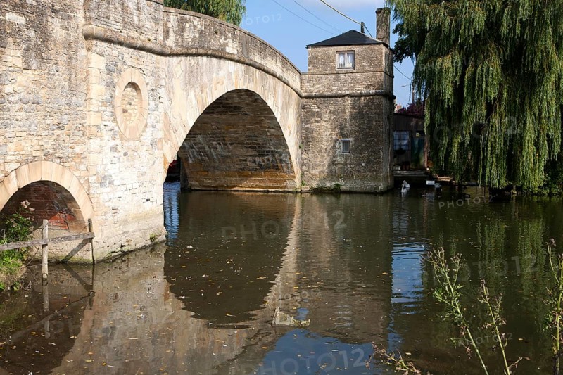 Historic stone bridge crossing River Thames at Lechlade on Thames, Gloucestershire, England, UK