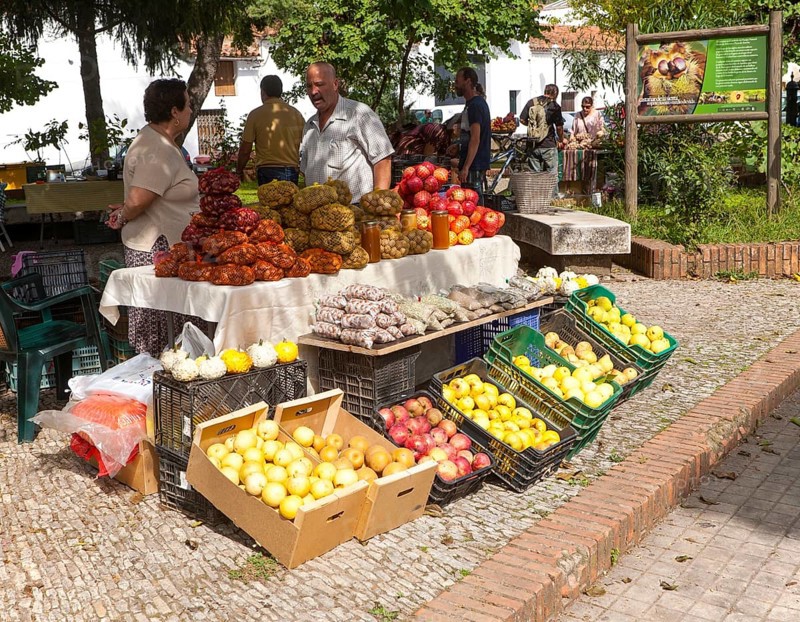 Selling chestnuts at a fruit and vegetable market stall in the village of Galaroza, Sierra de Aracena, Huelva province, Spain, Europe