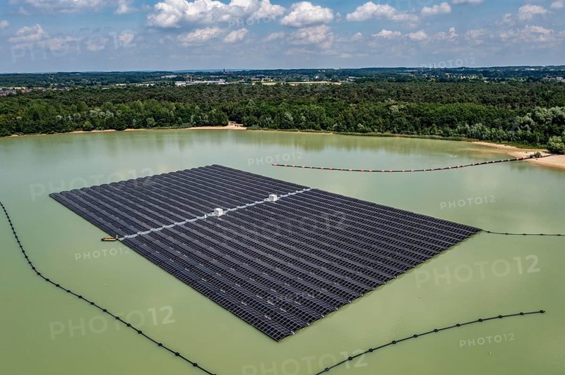 Germany's largest floating solar power plant on the Silbersee III, a quarry pond no longer used for sand mining, near Haltern am See, operated by Quarzwerke GmbH, around 5800 solar modules, on an area of a good 2 football pitches, generate 3.1 megawatts of power, the company uses the electricity itself on weekdays, at weekends it flows into the public grid, North Rhine-Westphalia, Germany, Europe