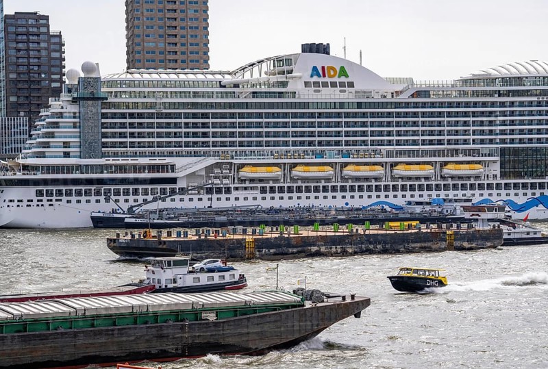 The cruise ship AIDA Prima being refuelled, moored at the Cruise Terminal Rotterdam, shipping traffic on the Nieuwe Maas, water taxi, Netherlands