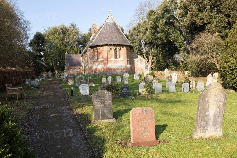 Holy Trinity Village parish church Oare, Wiltshire, England, UK built 1858 red brick Victorian nineteenth century building