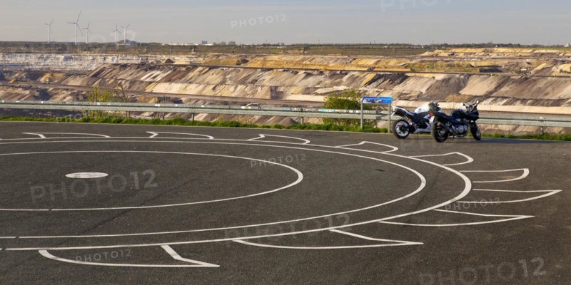 Car park at Skywalk Jackerath with painted bucket wheel, Garzweiler, Jüchen, opencast lignite mine, North Rhine-Westphalia, Germany, Europe