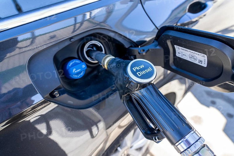 Diesel car is refuelled with diesel fuel, petrol station