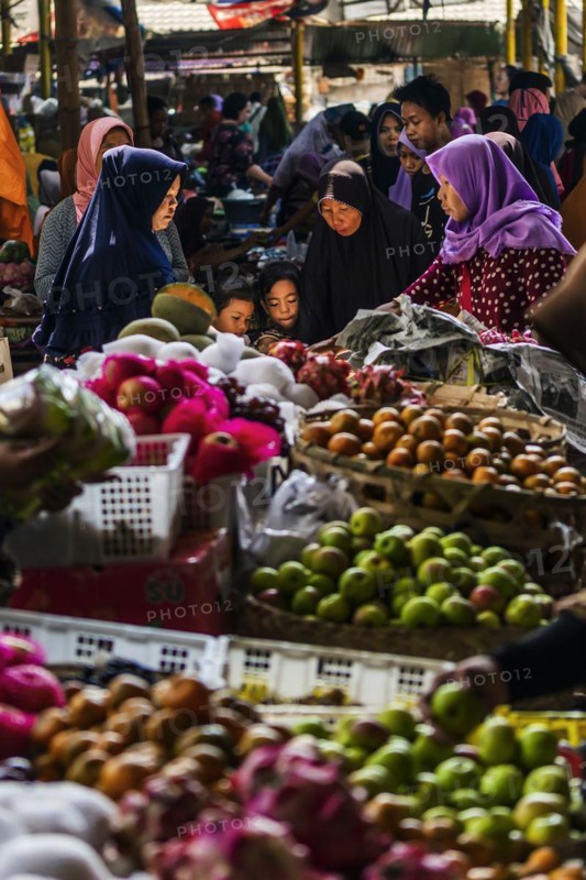 Traditional authentic food market, vendor, woman, fruit, vegetable, fresh, food, nutrition, sale, trade, bazaar, authentic, disease vector, food law, food control, stall, Asian, vegetable market, local, hygiene, virus, tradition, traditional, health, marketplace, market hall, tropical, travel, tourism, culture, poverty, presentation, cleanliness, person, family, Muslim, Islam, Lombok, Indonesia, Asia