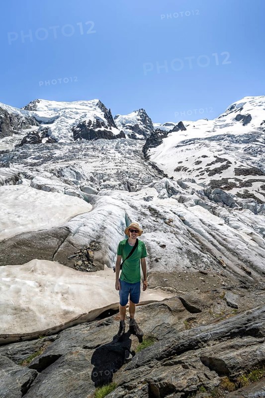 Mountaineers on the glacier, High alpine glaciated mountain landscape, La Jonction, Glacier des Bossons meets Glacier de Taconnaz, Summit of Mont Maudit and Mont Blanc, Chamonix, Haute-Savoie, France, Europe