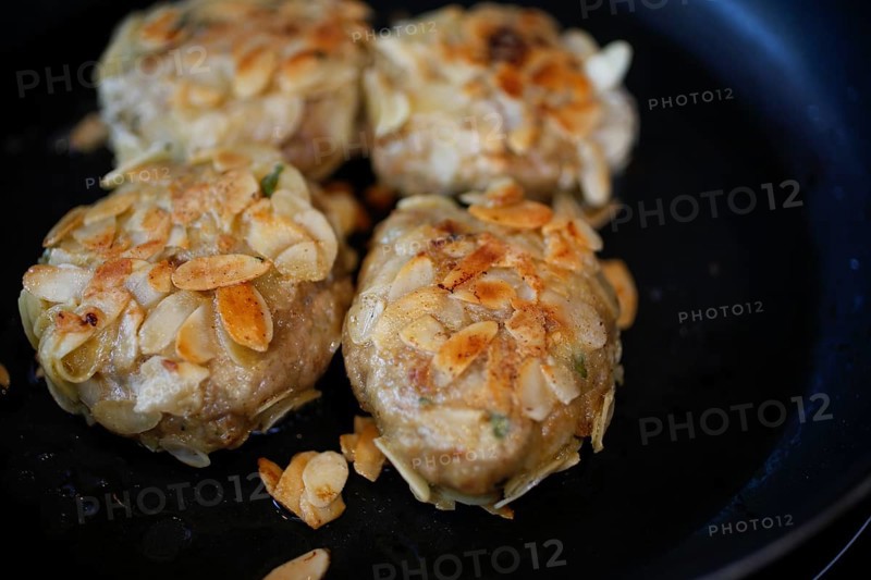 Swabian cuisine, meatballs wrapped in almonds, mixed minced meat, frying meatballs in fat, frying pan, meatballs, grandmother's cooking, regional, home cooking, typical Swabian, traditional cuisine reinterpreted, food photography, studio, Germany, Europe