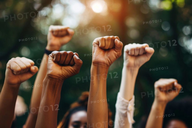 Close up of women's raised fists. KI generiert, generiert, AI generated