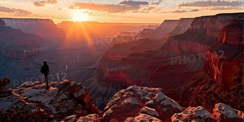 Sunrise over grand canyon in vibrant colors casting light on overhanging rock formations, AI generated