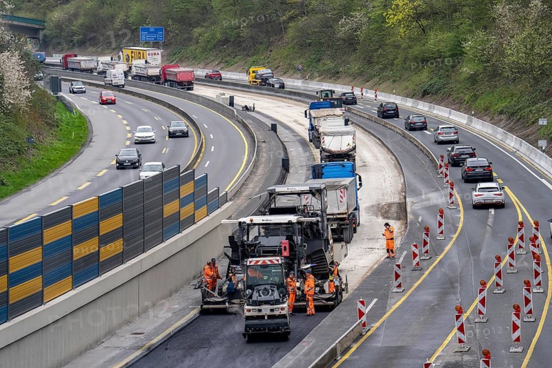 Motorway construction site on the A52 in Essen Basic refurbishment of the motorway, new noise barriers, sewerage system, new road surface, asphalting work, North Rhine-Westphalia, Germany, Europe