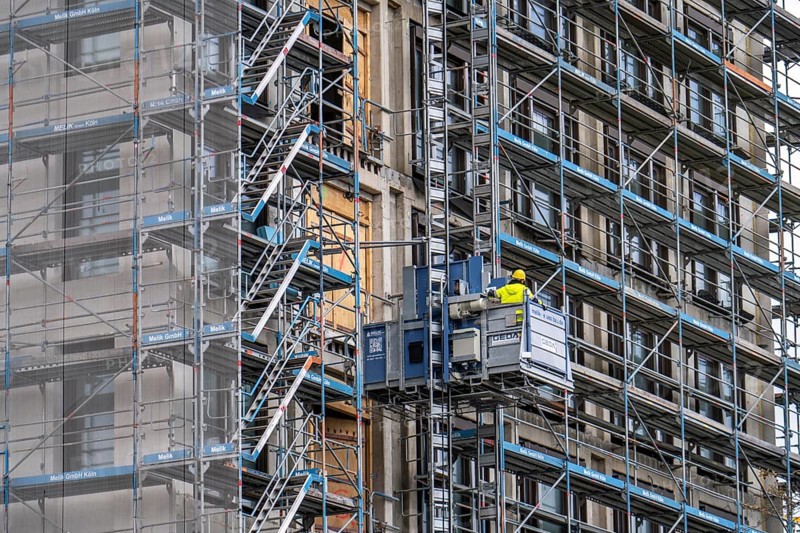 Construction site, construction site lift, new construction of a high-rise office building, facade of the shell, scaffolding, Cologne, North Rhine-Westphalia, Germany, Europe