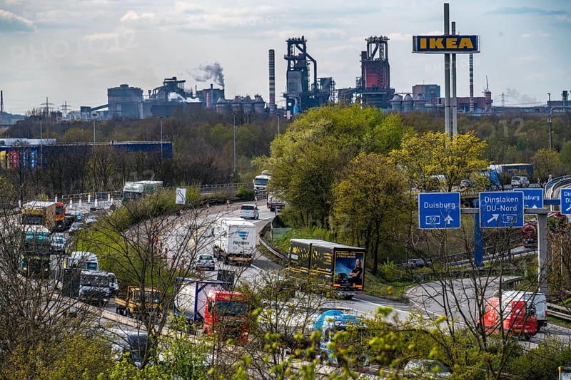 Duisburg-Nord motorway junction, A42 and A59 motorways, heavy traffic, blast furnaces of Thyssenkrupp Steel in Duisburg-Bruckhausen, IKEA furniture store, North Rhine-Westphalia, Germany, Europe