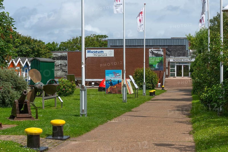 Museum in the North Sea Hall in Unterland, outdoor area with lobster shacks and maritime elements, ship's propeller, historic cannon, bollard, path, offshore island of Heligoland, North Sea, Pinneberg district, Schleswig-Holstein, Germany, Europe