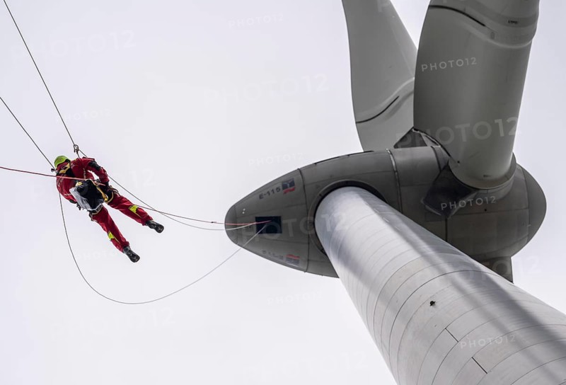 Height rescuers from the Oberhausen fire brigade practise abseiling from a wind turbine from a height of 150 metres after rescuing an accident victim from the nacelle, Issum, North Rhine-Westphalia, Germany, Europe