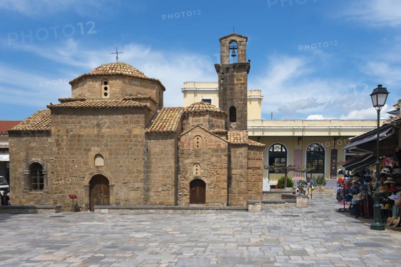Stone church with bell tower, tourists nearby on a street, Byzantine church, Church of the Apostles, Agii Apostoli, Cross-domed church, Kalamata, Messinia, Peloponnese, Greece, Europe