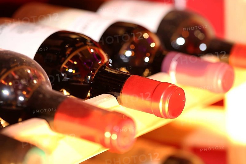 Wine cellar with red wine bottles