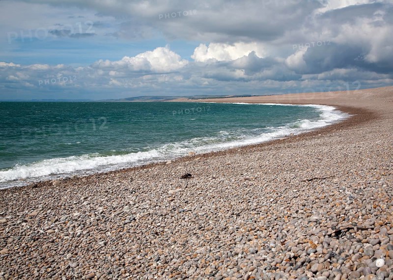 Sweeping bay and shingle beach of Chesil Beach from Chiswell, Isle of Portland, Dorset, England, UK
