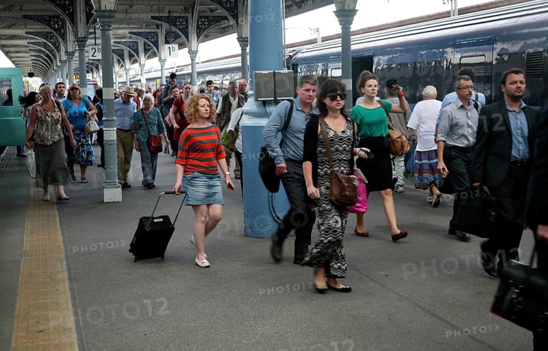 Crowd of passengers leaving their trains on the platform at Norwich railway station, Norfolk, England, United Kingdom, Europe