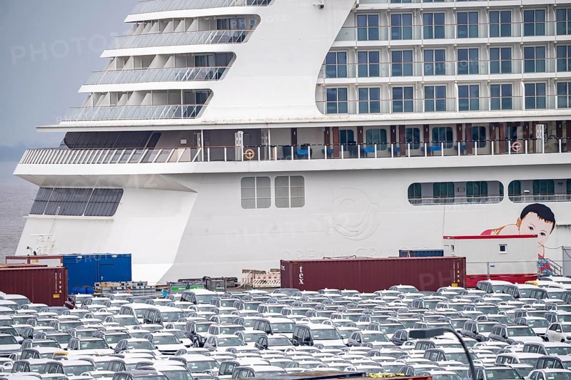 Parking space for import vehicles, hundreds of Hyundai Ioniq, electric cars, waiting for onward transport, cruise ship World Dream, Manara, at the EUROGATE container terminal in the overseas port of Bremerhaven, Lower Saxony, Germany, Europe