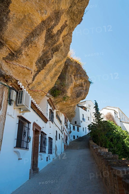 White houses in Setenil de las Bodegas under rocks, sunny sky, cave dwellings, Setenil de las Bodegas, Cadiz, Andalusia, Spain, Europe