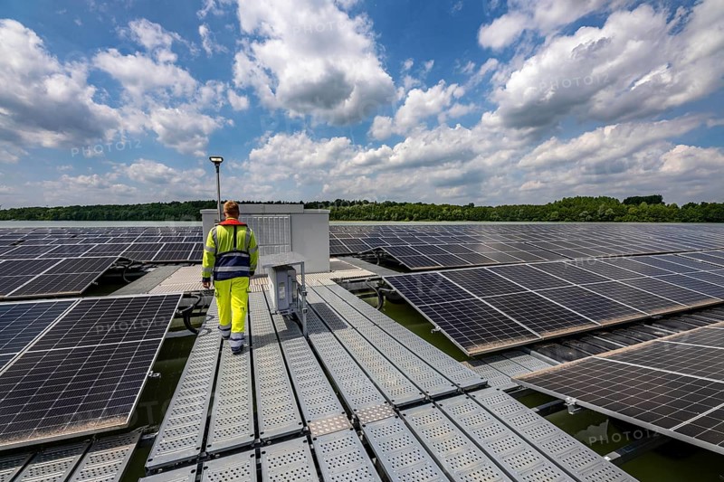 Germany's largest floating solar power plant on the Silbersee III, a quarry pond no longer used for sand mining, near Haltern am See, operated by Quarzwerke GmbH, around 5800 solar modules, on an area of a good 2 football pitches, generate 3.1 megawatts of power, the company uses the electricity itself on weekdays, at weekends it flows into the public grid, North Rhine-Westphalia, Germany, Europe