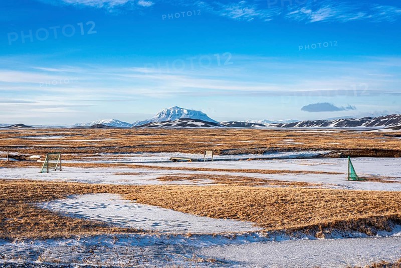View over snow-covered football playground towards Mt. Herdubreid, winter, farm Mödrudalur, located between lake Myvatn and Egilsstadir, Iceland, Europe